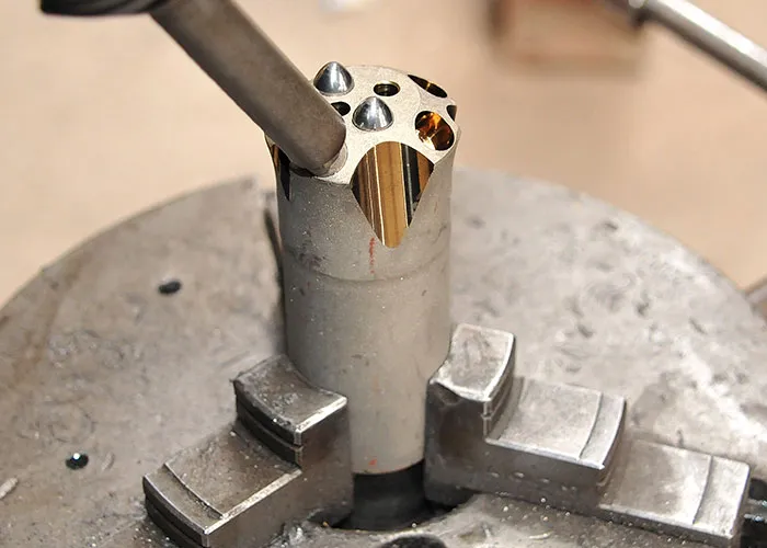 In-house carbide button fitting