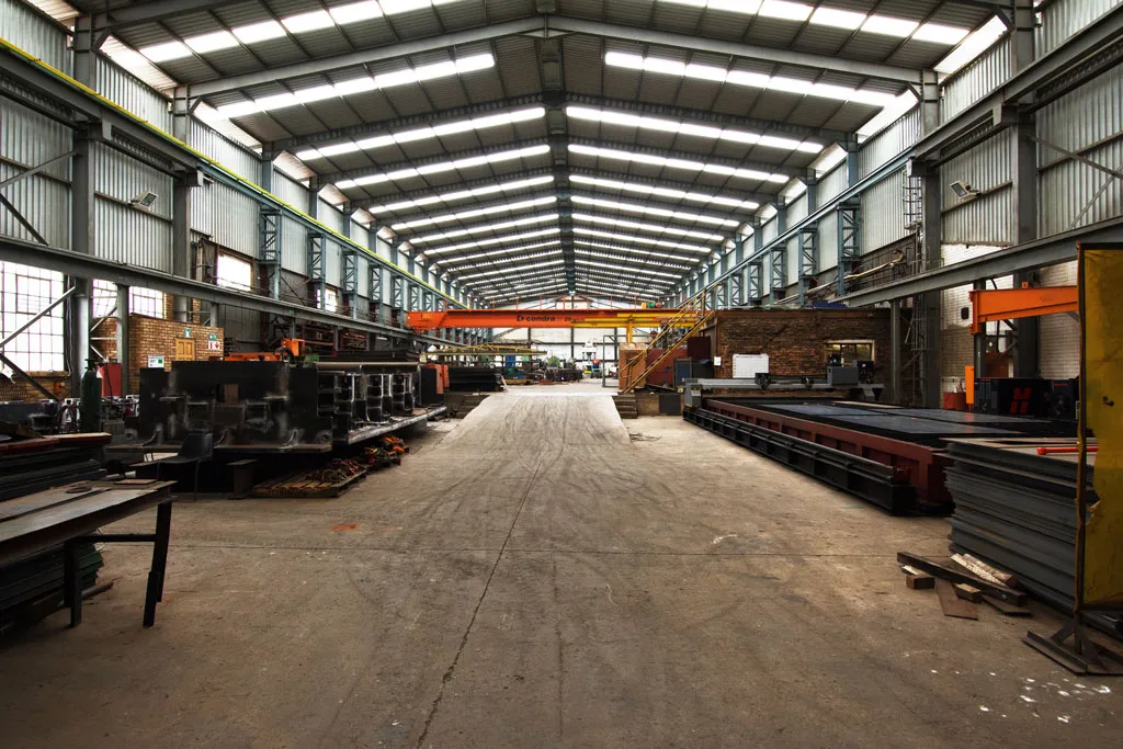 DTH drill bit with carbide buttons